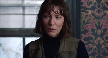 Movie still from “Where'd You Go, Bernadette” (2019), directed by Richard Linklater – A person wearing a vest; Close Up shot, Over the shoulder angle