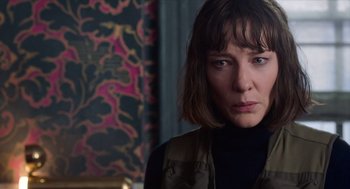 Movie still from “Where'd You Go, Bernadette” (2019), directed by Richard Linklater – A person wearing a vest; Close Up shot, Over the shoulder angle