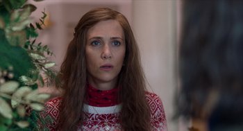 Movie still from “Where'd You Go, Bernadette” (2019), directed by Richard Linklater – A woman with long brown hair wearing a red and white sweater; Close Up shot, Over the shoulder angle