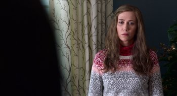 Movie still from “Where'd You Go, Bernadette” (2019), directed by Richard Linklater – A woman in a sweater standing in front of a curtain; Close Up shot, Over the shoulder angle