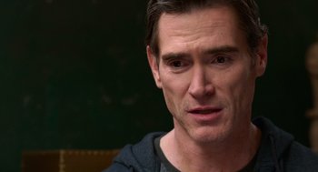 Movie still from “Where'd You Go, Bernadette” (2019), directed by Richard Linklater – A man's face in a black shirt; Close Up shot, Over the shoulder angle