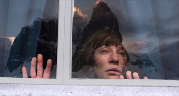 Movie still from “Where'd You Go, Bernadette” (2019), directed by Richard Linklater – A woman looking out of a window at dusk; Close Up shot, Low angle