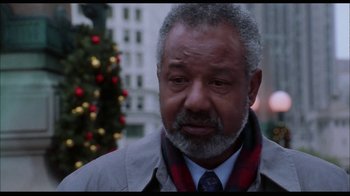 Movie still from “While You Were Sleeping” (1995), directed by Jon Turteltaub – An older man wearing a jacket and a neck tie; Close Up shot, Low angle