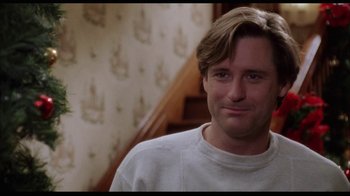 Movie still from “While You Were Sleeping” (1995), directed by Jon Turteltaub – A person wearing a white shirt; Close Up shot, Over the shoulder angle