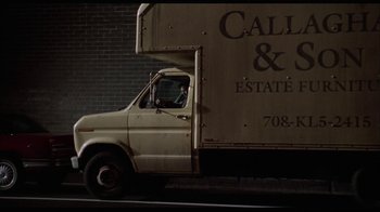 Movie still from “While You Were Sleeping” (1995), directed by Jon Turteltaub – A white truck parked on the side of the road; Wide shot, Low angle