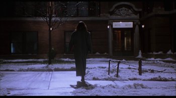 Movie still from “While You Were Sleeping” (1995), directed by Jon Turteltaub – A person walking on a sidewalk in the snow; Extreme Wide shot, Low angle
