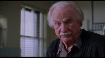Movie still from “While You Were Sleeping” (1995), directed by Jon Turteltaub – An old man with a mustache and a beard; Close Up shot, Low angle