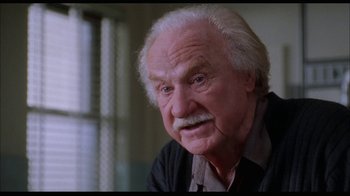 Movie still from “While You Were Sleeping” (1995), directed by Jon Turteltaub – An old man with a beard and a mustache; Close Up shot, Low angle
