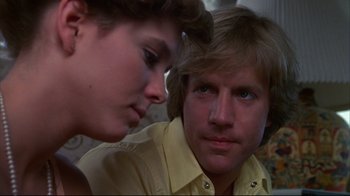Movie still from “White Dog” (1982), directed by Samuel Fuller – A man and a woman looking at one another; Close Up shot, Low angle