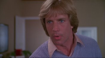 Movie still from “White Dog” (1982), directed by Samuel Fuller – A person wearing a sweater; Close Up shot, Low angle