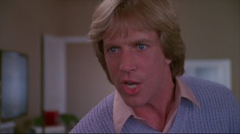 Movie still from “White Dog” (1982), directed by Samuel Fuller – A person wearing a sweater; Close Up shot, Low angle