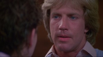 Movie still from “White Dog” (1982), directed by Samuel Fuller – A person talking to another person; Close Up shot, Over the shoulder angle