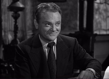 Movie still from “White Heat” (1949), directed by Raoul Walsh – An older man in a suit sitting in a chair; Close Up shot, High angle