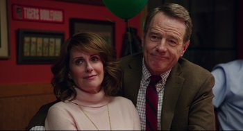 Movie still from “Why Him?” (2016), directed by John Hamburg – A man and a woman posing for a picture; Close Up shot, Over the shoulder angle