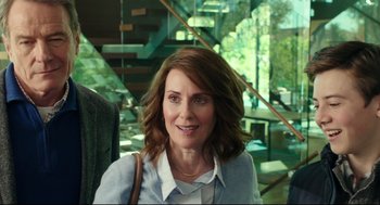 Movie still from “Why Him?” (2016), directed by John Hamburg – A person with long brown hair; Medium shot, Over the shoulder angle