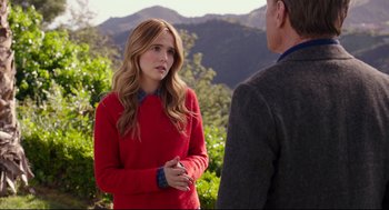 Movie still from “Why Him?” (2016), directed by John Hamburg – A woman in a red sweater talking to a man in a gray jacket; Medium shot, Over the shoulder angle
