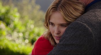 Movie still from “Why Him?” (2016), directed by John Hamburg – A beautiful young lady holding a blanket over her face; Close Up shot, Over the shoulder angle