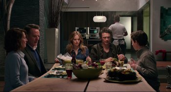 Movie still from “Why Him?” (2016), directed by John Hamburg – A man and a woman sitting at a dinner table; Medium shot, Over the shoulder angle