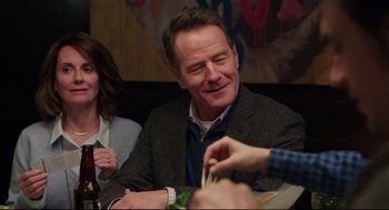 Movie still from “Why Him?” (2016), directed by John Hamburg – A man sitting in front of a woman holding chopsticks in his hand; Close Up shot, Over the shoulder angle