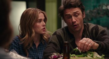 Movie still from “Why Him?” (2016), directed by John Hamburg – A man and a woman sitting next to each other at a table; Close Up shot, Over the shoulder angle