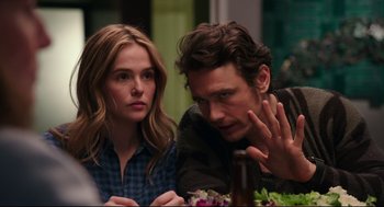 Movie still from “Why Him?” (2016), directed by John Hamburg – A man and a woman sitting next to each other at a table; Close Up shot, Over the shoulder angle