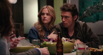 Movie still from “Why Him?” (2016), directed by John Hamburg – A man and a woman sitting at a dinner table; Medium shot, Over the shoulder angle