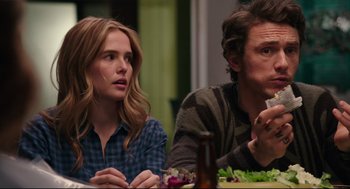 Movie still from “Why Him?” (2016), directed by John Hamburg – A man and a woman sitting at a dinner table; Close Up shot, Over the shoulder angle