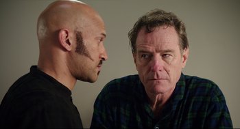 Movie still from “Why Him?” (2016), directed by John Hamburg – A man and a bald man face each other; Close Up shot, Over the shoulder angle