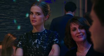 Movie still from “Why Him?” (2016), directed by John Hamburg – A woman standing next to another woman in a room; Close Up shot, Over the shoulder angle