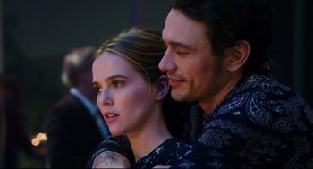 Movie still from “Why Him?” (2016), directed by John Hamburg – A man and a woman sitting next to each other; Close Up shot, Over the shoulder angle