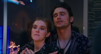 Movie still from “Why Him?” (2016), directed by John Hamburg – A man and a woman standing next to each other; Close Up shot, Low angle