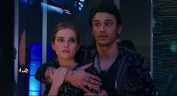 Movie still from “Why Him?” (2016), directed by John Hamburg – A man and a woman standing next to each other; Medium shot, Over the shoulder angle