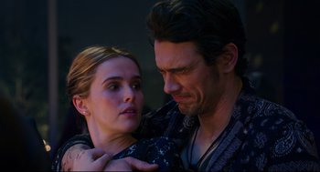 Movie still from “Why Him?” (2016), directed by John Hamburg – A man and a woman embracing each other in the dark; Close Up shot, Over the shoulder angle