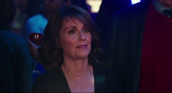 Movie still from “Why Him?” (2016), directed by John Hamburg – A person wearing a necklace; Close Up shot, Over the shoulder angle