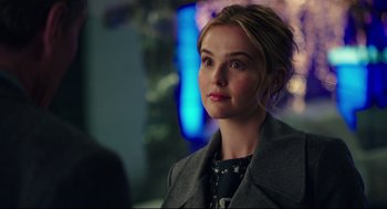 Movie still from “Why Him?” (2016), directed by John Hamburg – A woman in a gray coat looking to her left; Close Up shot, Over the shoulder angle