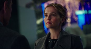 Movie still from “Why Him?” (2016), directed by John Hamburg – A woman in a gray coat looking to her left; Close Up shot, Over the shoulder angle
