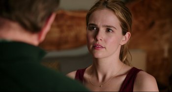 Movie still from “Why Him?” (2016), directed by John Hamburg – A young woman looking at a man in a green shirt; Close Up shot, Over the shoulder angle