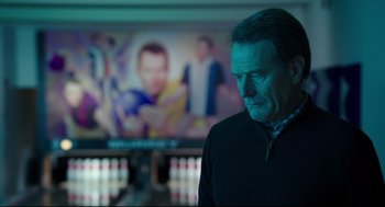 Movie still from “Why Him?” (2016), directed by John Hamburg – A man standing in front of a bowling alley; Close Up shot, Over the shoulder angle