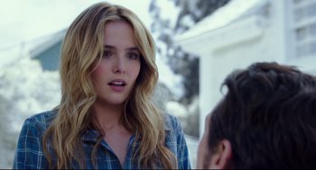 Movie still from “Why Him?” (2016), directed by John Hamburg – A woman with long blonde wavy hair and a plaid shirt; Close Up shot, Over the shoulder angle