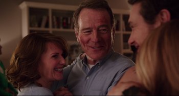 Movie still from “Why Him?” (2016), directed by John Hamburg – Two men and a woman smiling for the camera; Close Up shot, Over the shoulder angle