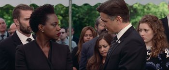 Movie still from “Widows” (2018), directed by Steve McQueen – A man and a woman in a crowd of people; Close Up shot, Over the shoulder angle