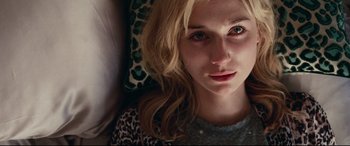 Movie still from “Widows” (2018), directed by Steve McQueen – A person with long blonde hair; Close Up shot, Overhead angle