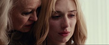 Movie still from “Widows” (2018), directed by Steve McQueen – A person with their hand on her face; Close Up shot, Low angle