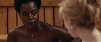 Movie still from “Widows” (2018), directed by Steve McQueen – A woman looking in the reflection of a mirror; Close Up shot, Over the shoulder angle
