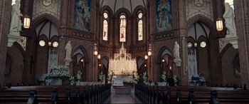 Movie still from “Widows” (2018), directed by Steve McQueen – A large church with a large stained glass window; Extreme Wide shot, High angle