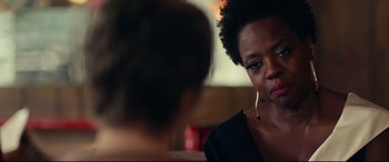 Movie still from “Widows” (2018), directed by Steve McQueen – A woman sitting in front of another woman in front of a mirror; Close Up shot, Over the shoulder angle