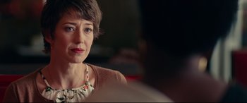 Movie still from “Widows” (2018), directed by Steve McQueen – A person wearing a necklace; Close Up shot, Over the shoulder angle