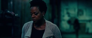 Movie still from “Widows” (2018), directed by Steve McQueen – A black woman with short black hair wearing a jacket; Close Up shot, Over the shoulder angle