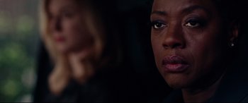 Movie still from “Widows” (2018), directed by Steve McQueen – A woman's face in the dark; Close Up shot, Over the shoulder angle