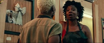 Movie still from “Widows” (2018), directed by Steve McQueen – Two women standing in front of each other in front of a bathroom mirror; Close Up shot, Over the shoulder angle